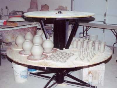 Revolving Table with freshly-thrown teapots